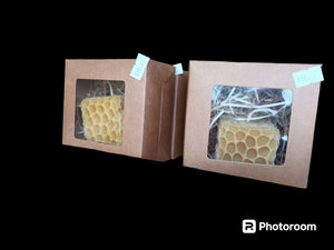 Square beeswax candle in gift box.